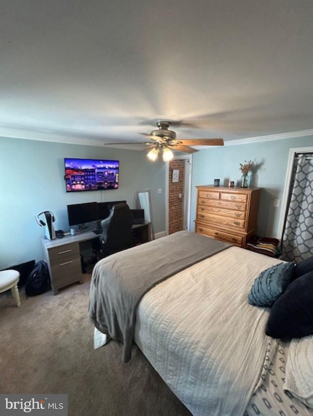 bedroom with crown molding, carpet flooring, and ceiling fan