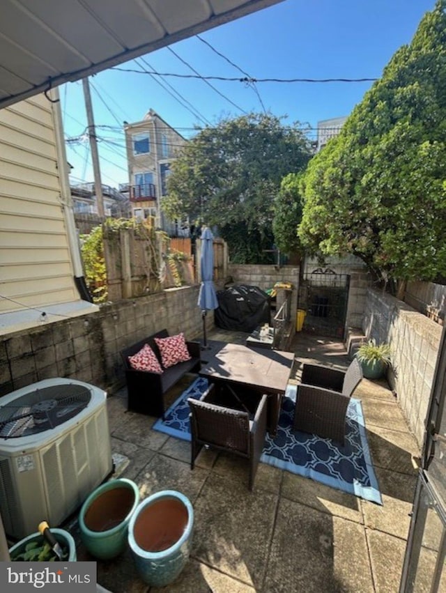 view of patio featuring an outdoor living space and central AC unit