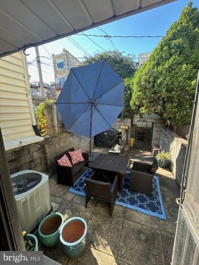 view of patio with central AC unit