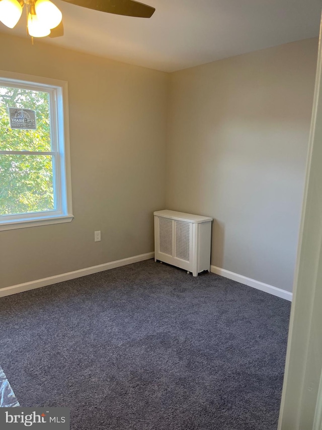 carpeted empty room with ceiling fan