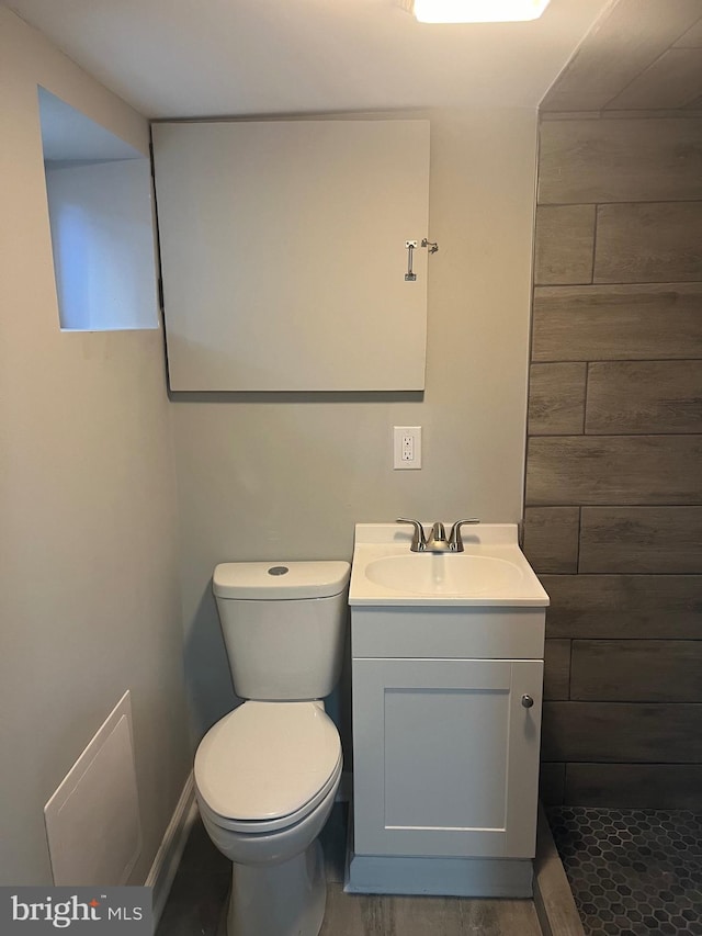 bathroom with vanity, hardwood / wood-style floors, and toilet