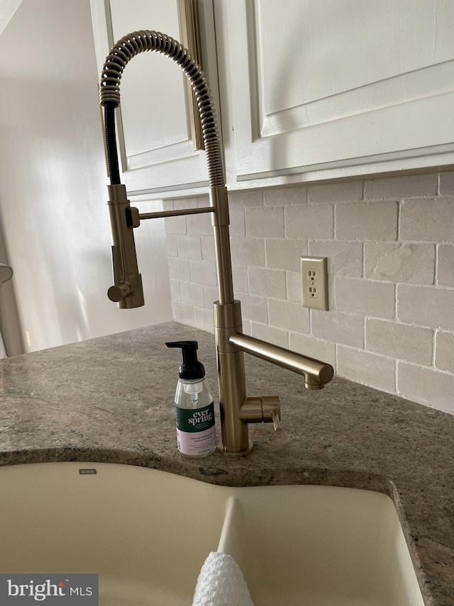 interior details with sink and decorative backsplash