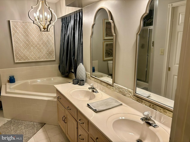 full bathroom featuring vanity, a notable chandelier, tile patterned flooring, toilet, and shower with separate bathtub