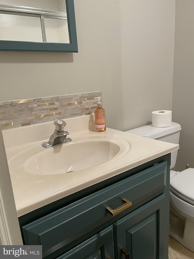 bathroom with vanity and toilet