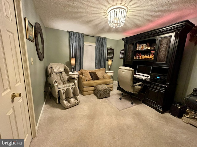 office space featuring light carpet and a textured ceiling