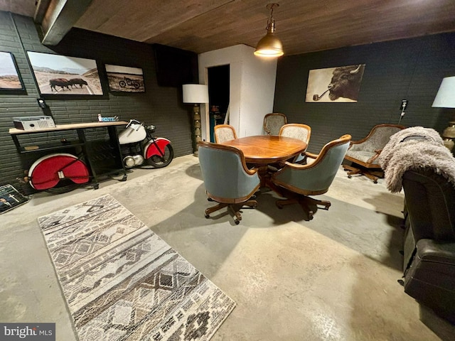 dining room with wooden ceiling and concrete floors