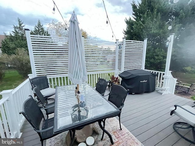 wooden deck with grilling area