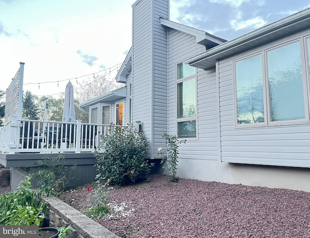 view of home's exterior featuring a deck