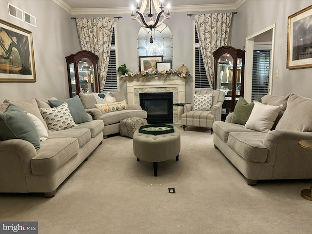 carpeted living room featuring a premium fireplace, crown molding, and a notable chandelier