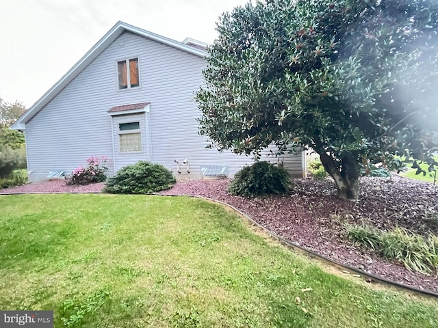 view of home's exterior featuring a lawn