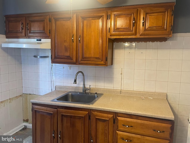 kitchen with tasteful backsplash and sink