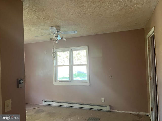 empty room featuring a baseboard heating unit, a textured ceiling, and ceiling fan