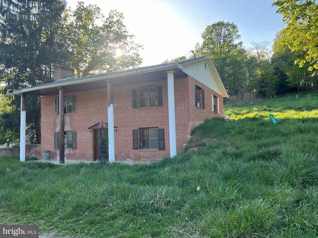 view of home's exterior featuring a lawn