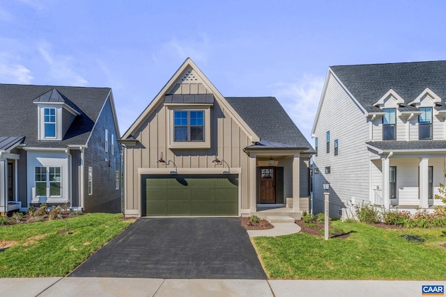 view of front of home with a garage and a front yard