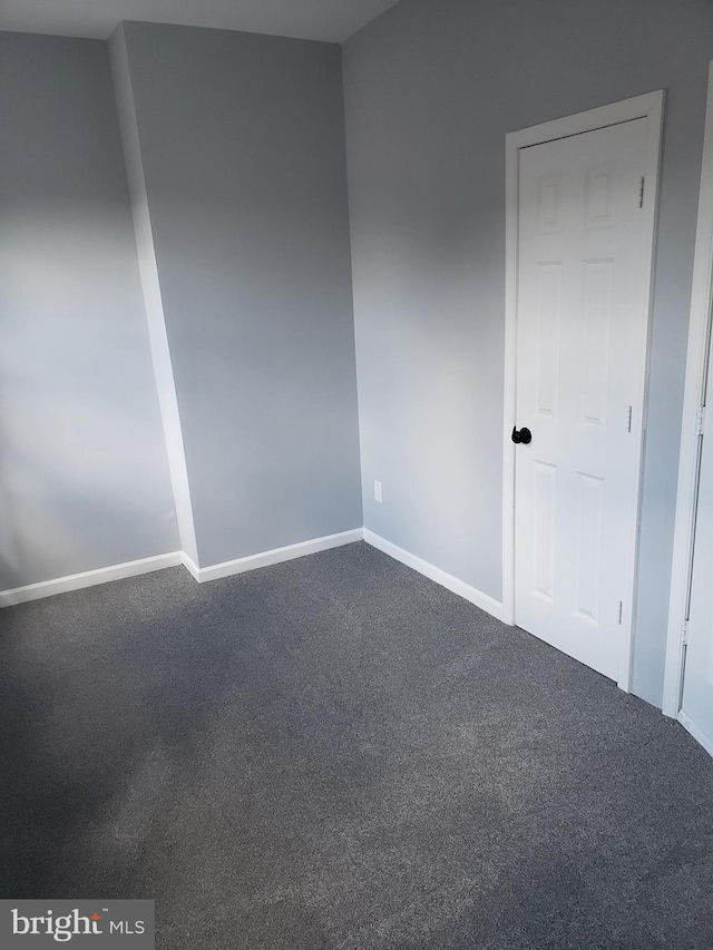 unfurnished room with carpet floors