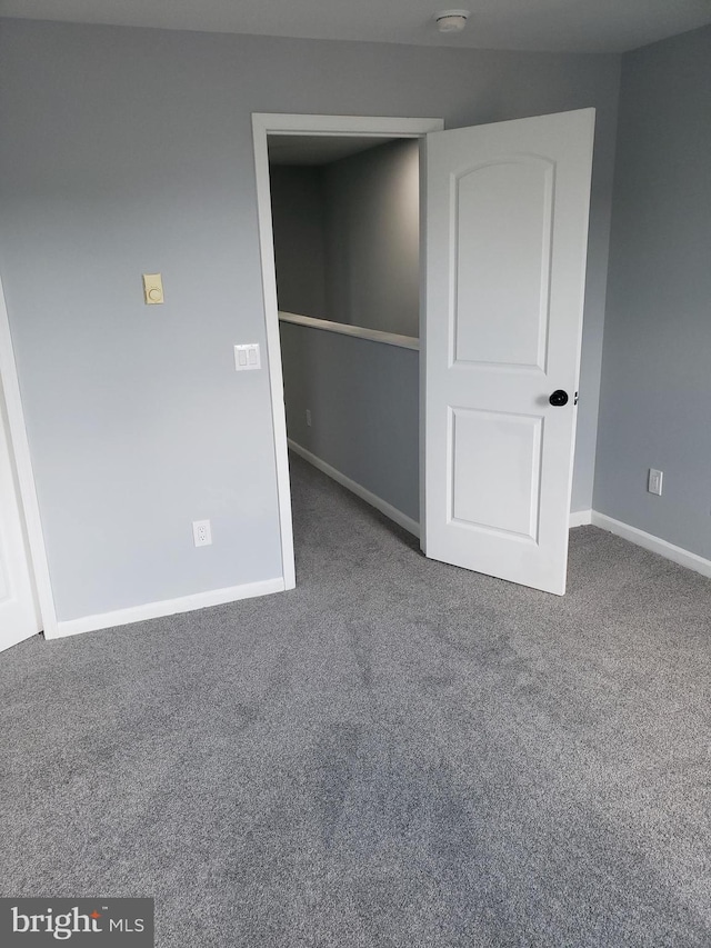 unfurnished bedroom with carpet floors