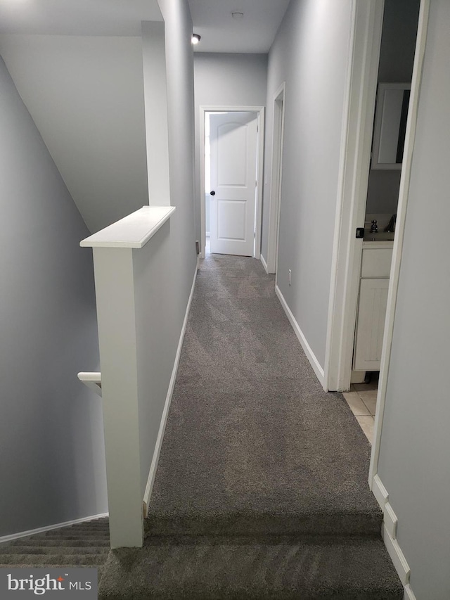 hallway with light carpet