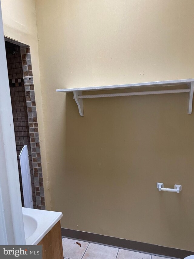 bathroom with vanity and tile patterned flooring