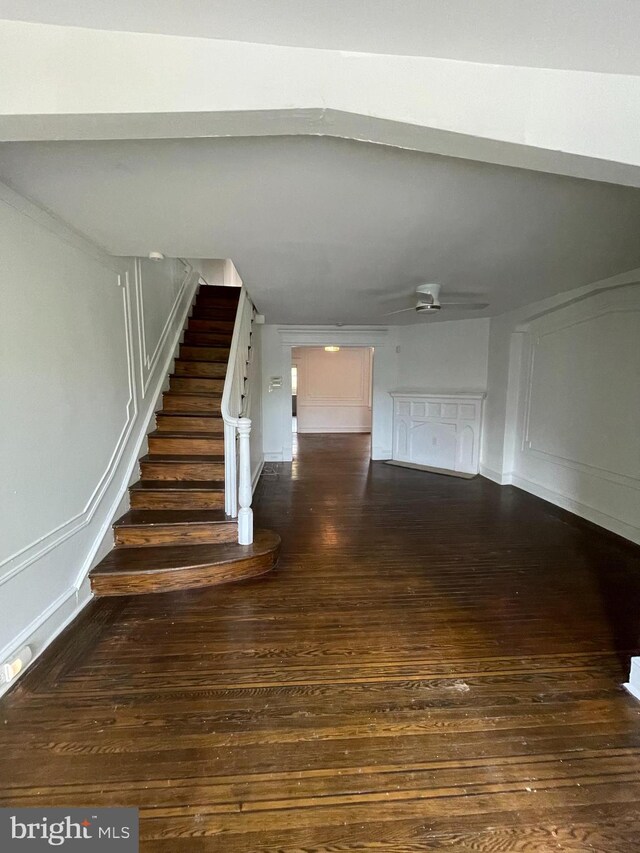 stairs featuring hardwood / wood-style floors