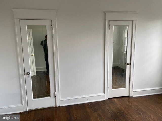 unfurnished bedroom featuring dark wood-type flooring