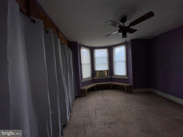 empty room featuring carpet and ceiling fan