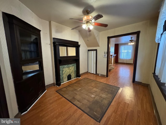 corridor with hardwood / wood-style floors