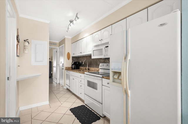 kitchen featuring backsplash, ornamental molding, light tile patterned floors, white cabinets, and white appliances