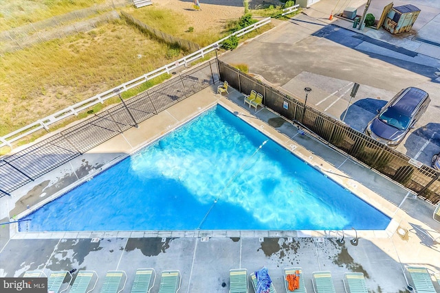 view of swimming pool featuring a patio area