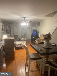 dining area featuring hardwood / wood-style floors and ceiling fan