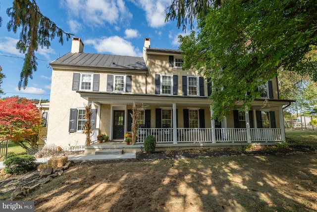 colonial house featuring a porch