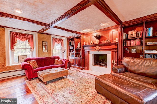 living room featuring coffered ceiling, beamed ceiling, ornamental molding, hardwood / wood-style floors, and a textured ceiling