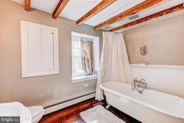 bathroom with a tub to relax in, hardwood / wood-style floors, toilet, baseboard heating, and beam ceiling