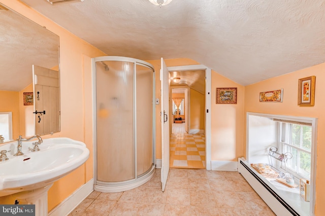 bathroom featuring a shower with door, a textured ceiling, baseboard heating, and vaulted ceiling