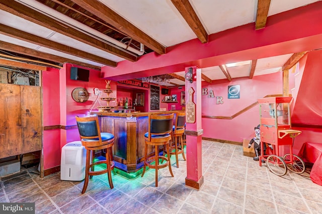 bar featuring beam ceiling