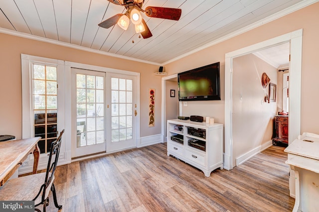 interior space featuring ornamental molding and light wood-type flooring