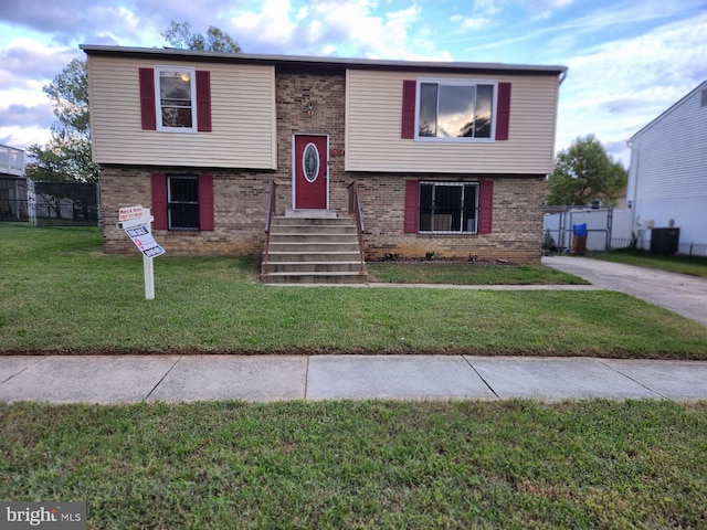 bi-level home with a front yard