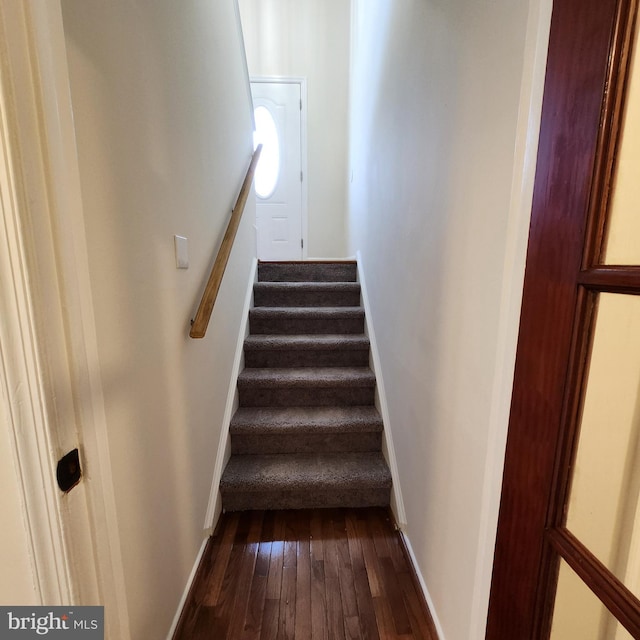 staircase featuring hardwood / wood-style floors