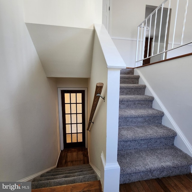 stairway featuring hardwood / wood-style flooring