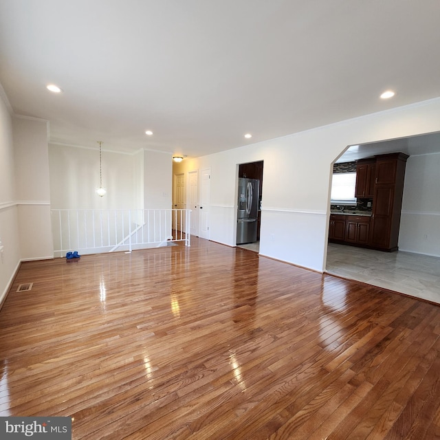 unfurnished living room featuring light hardwood / wood-style flooring