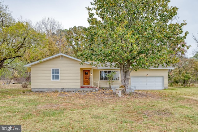 view of front of home featuring a garage and a front yard