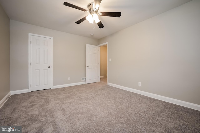 unfurnished bedroom featuring carpet flooring and ceiling fan