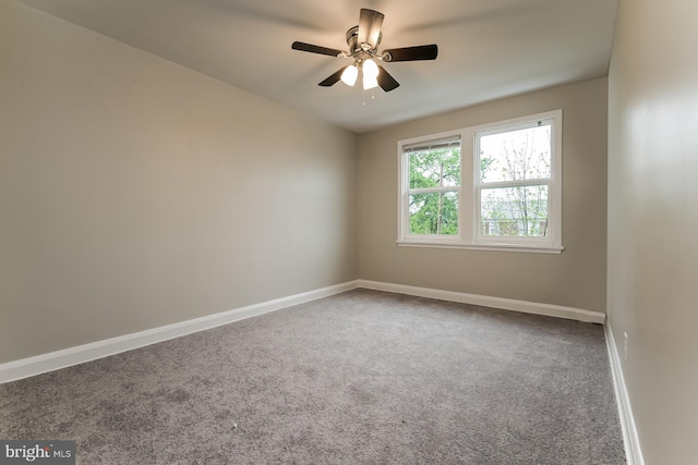 carpeted empty room featuring ceiling fan