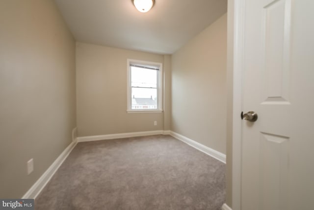 spare room with light colored carpet