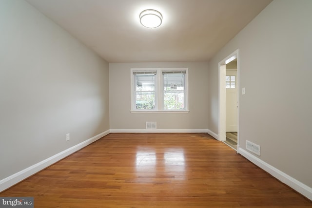 spare room featuring hardwood / wood-style flooring