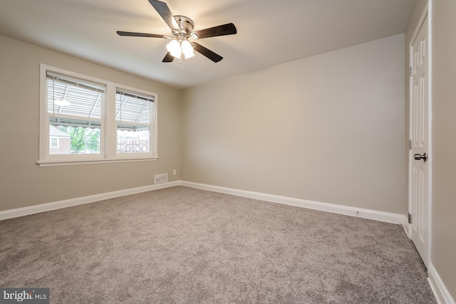 carpeted empty room with ceiling fan