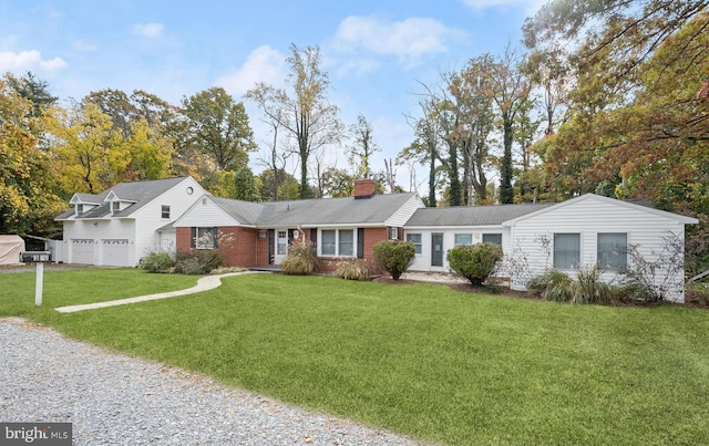 ranch-style home featuring a front yard and a garage