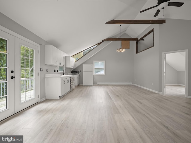 unfurnished living room featuring light hardwood / wood-style flooring, beam ceiling, a healthy amount of sunlight, and high vaulted ceiling