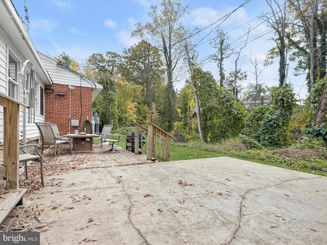 view of patio / terrace featuring a fire pit