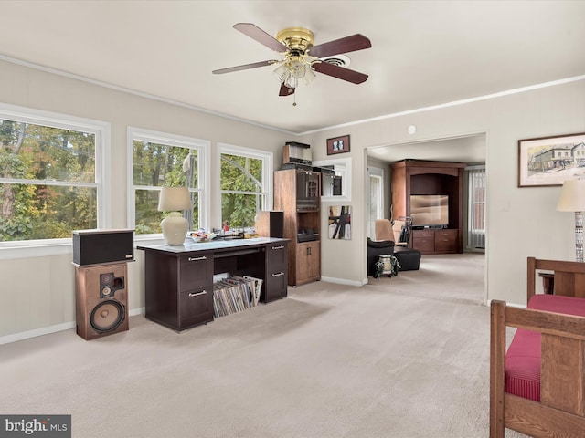 office with crown molding, light carpet, and ceiling fan