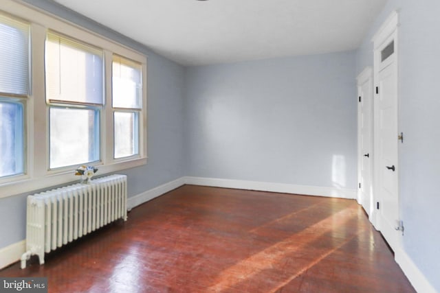 unfurnished room with radiator